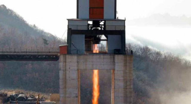 A test firing of a rocket engine North Korea claims will power an ICBM, in a state media photo.