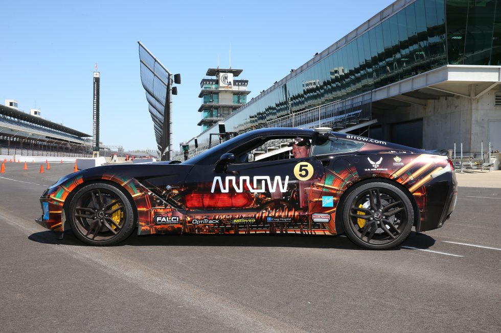 Sam Schmidt smiles from the driver's seat of Project SAM, the Corvette Stingray that's been modified to let him drive it, despite being paralyzed from the neck down.