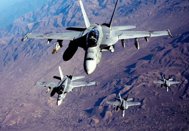 US Navy F/A-18F Super Hornets stack up for refueling over Afghanistan in 2010. Canada is looking to the latest Super Hornet as a way to put off buying F-35s.