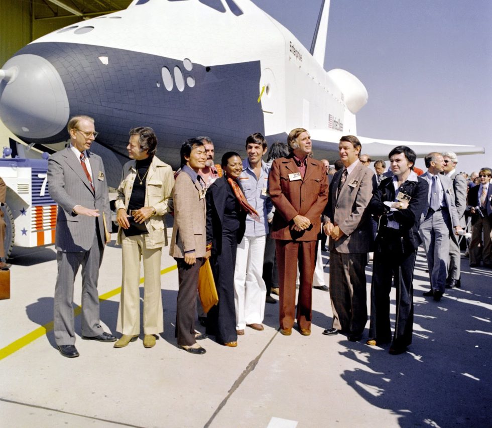 The crew of <em>Star Trek</em> gathers around space shuttle <em>Enterprise</em> in 1977.