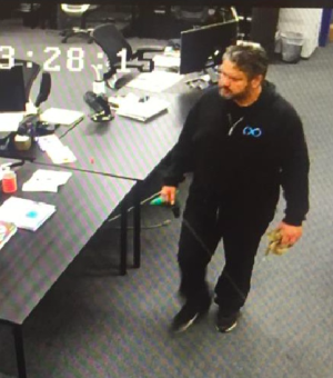A still from security camera footage in which BamBrogan claims Afshin Pishevar is walking to BamBrogan's desk with rope to leave a noose on his chair.