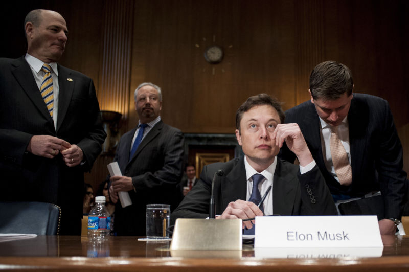 Elon Musk prepares to testify at a Senate Appropriations subcommittee hearing in Washington, D.C., U.S., on Wednesday, March 5, 2014.