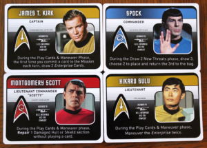 Four of the "character cards" listing their powers.