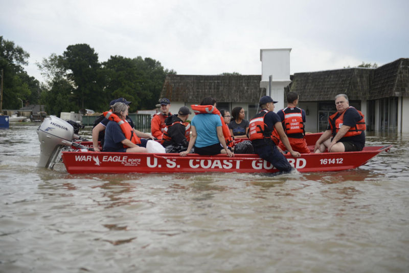 A Coast Guard boat carries several Baton Rouge residents to safety.