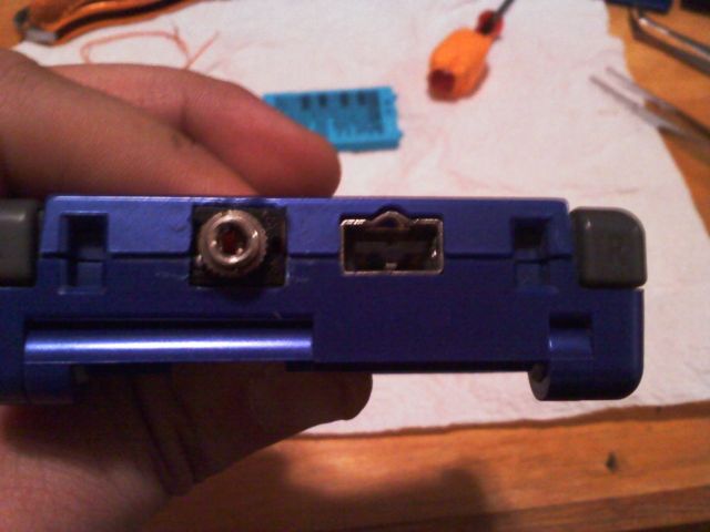 A GBA SP modded to replace the link cable port with a headphone jack.