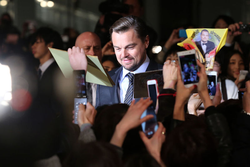 Leonardo DiCaprio signs autographs for fans during the Tokyo premiere for "The Revenant" in March.