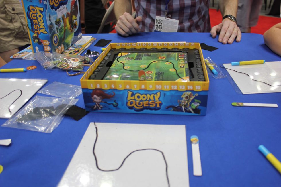 In <em>Loony Quest</em>, players have to trace their way through an obstacle course to get points. But they have to do so on an off-board transparent sheet of plastic.