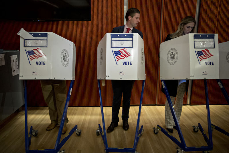 Eric Trump, son of then-presidential nominee Donald Trump, looks at wife Lara Yunaska's voting booth. An NSA report indicates Russia may have attempted to plant malware on the computers of election officials in the days before voting.