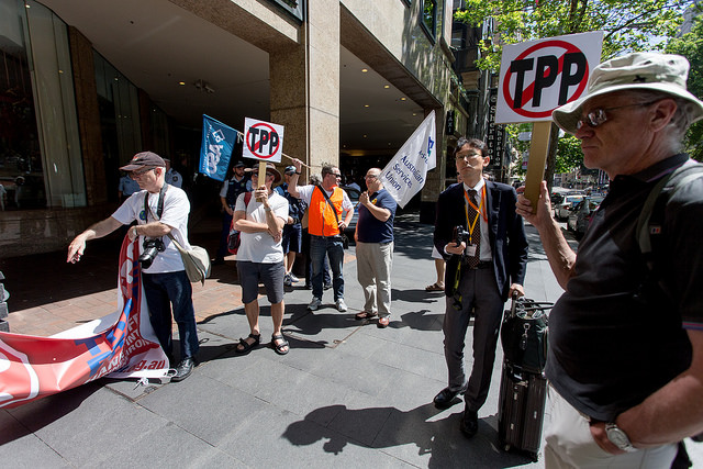 A handful of protesters rally in Sydney, Australia, in 2014 as government officials and private industry negotiated the Trans-Pacific Partnership accord.