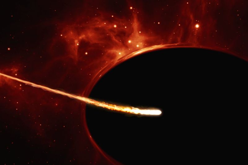 Artist's impression of a star like the Sun circling in toward a supermassive black hole, being torn apart by its tidal forces. The distortion around the black hole's edges is due to light from background stars being bent by the black hole's immense gravity.