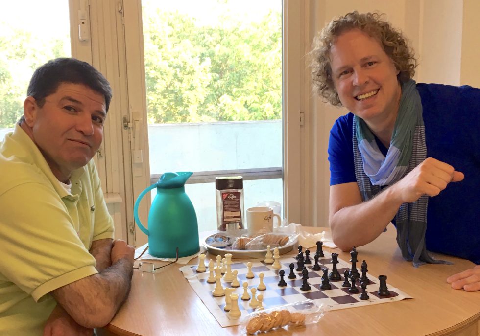 Allers (right) and a new friend playing chess in Berlin.