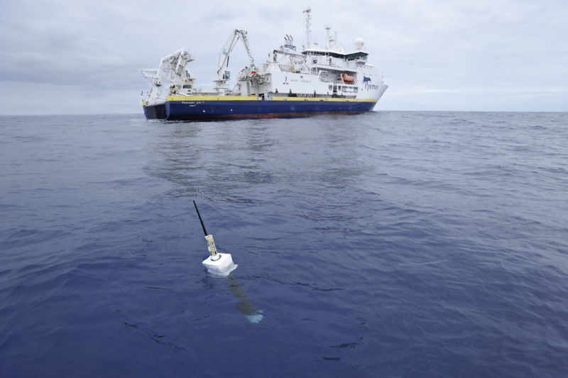 A research vessel drops off a float that will make measurements as it drifts.
