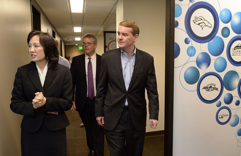 USPTO Deputy Director Michelle K. Lee, left, tours the Denver satellite office of the US Patent and Trademark Office in 2014. US Senator Michael Bennet of Colorado is on the right.