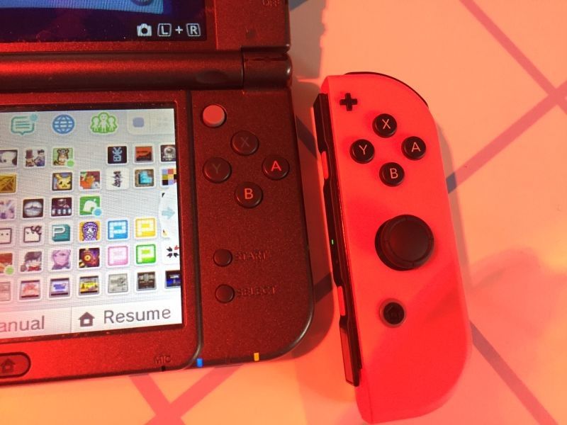 A Switch Joy-Con sits alongside a 3DS XL, just as Nintendo says the Switch will sit alongside the 3DS in the marketplace.