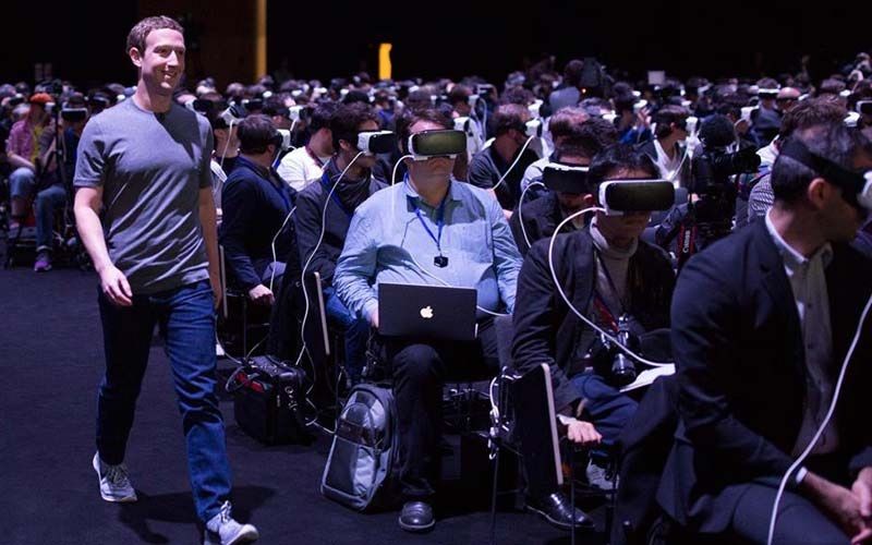 Facebook CEO Mark Zuckerberg wanders past oblivious people in Samsung Gear VR headsets in a photo that is not from this trial.