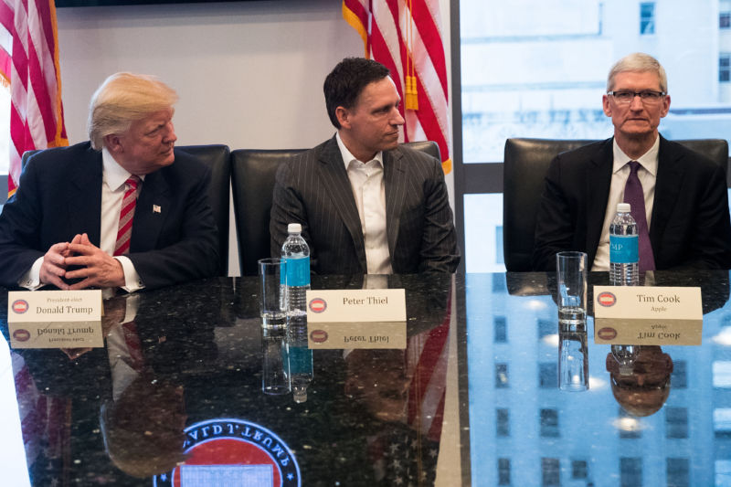 Donald Trump, Peter Thiel (center) met with and Apple CEO Tim Cook (right) and other leaders in December 2016.