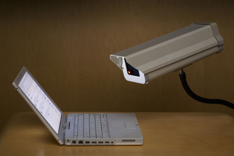 A security camera aimed at a laptop screen.
