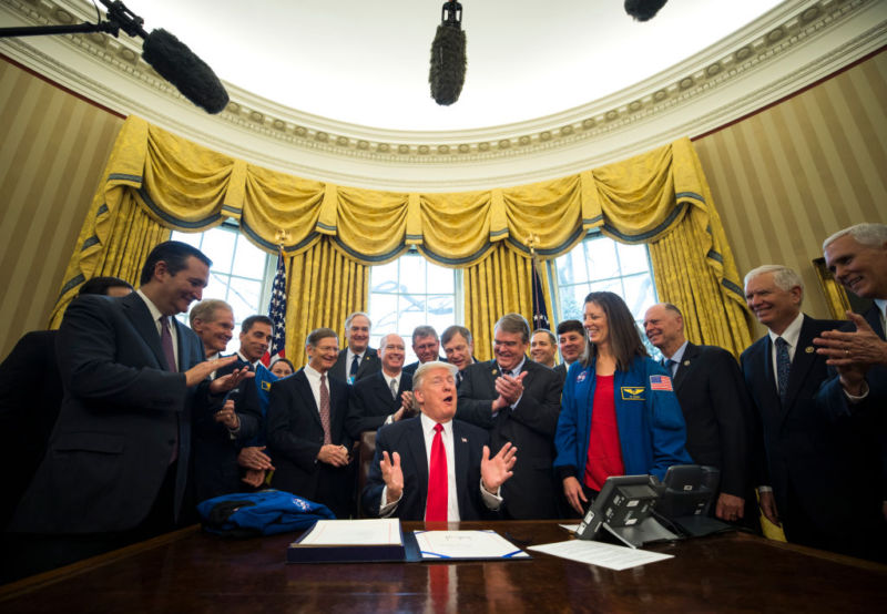 President Donald Trump speaks in the Oval Office of the White House after signing the NASA transition authorization bill.