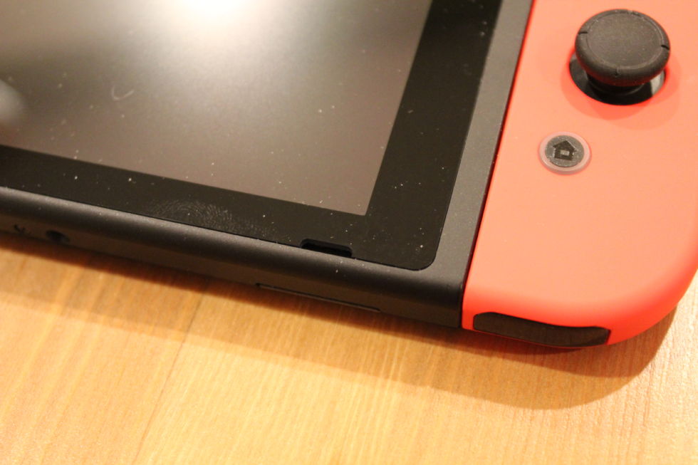 This black slit in the Switch hardware is one of its two speakers. It's just not loud enough for public use, and it's certainly not designed to bounce sound off a surface when propped up in "tablet" mode.