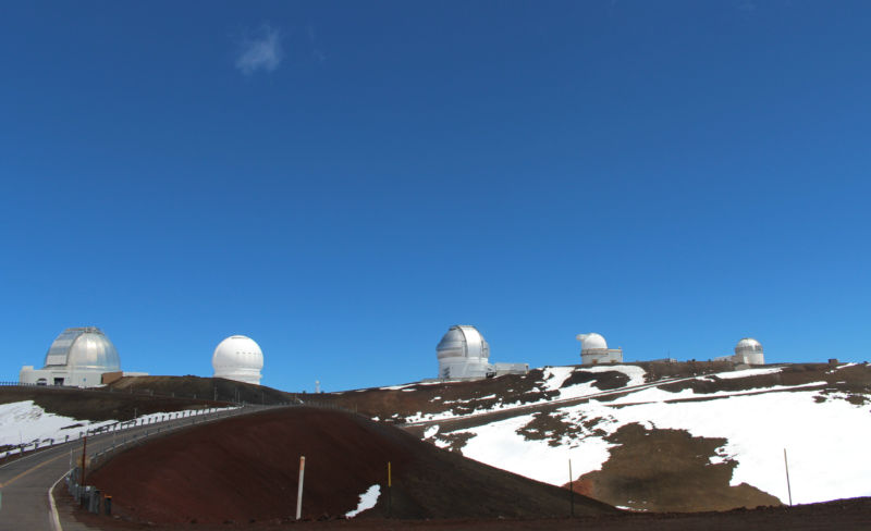 On the road, near the summit. There are presently 10 optical telescopes on top of Mauna Kea. 