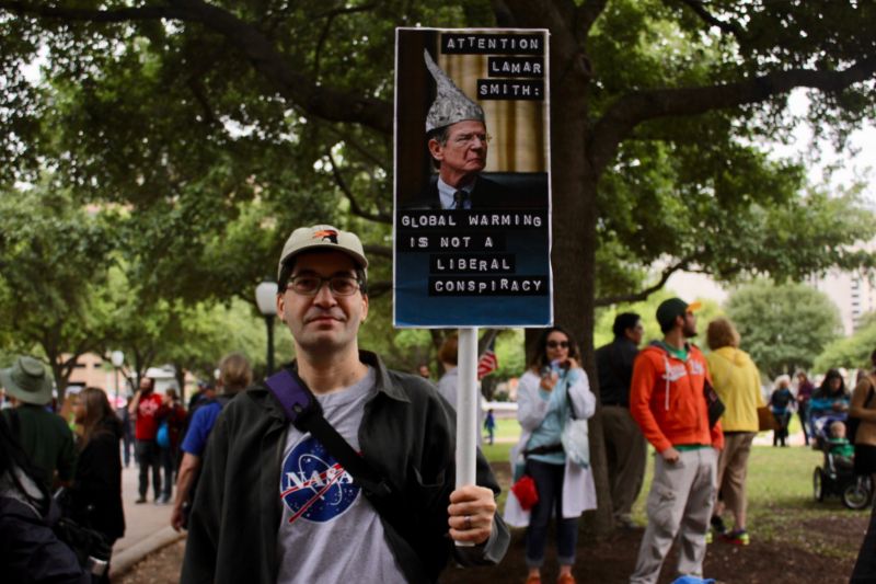 A protester at Science March Austin shares his frustration with Lamar Smith.