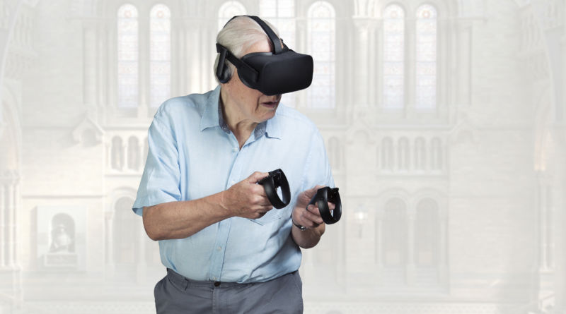 Sir David Attenborough con un visore e controller Sky VR. Photo: Sky