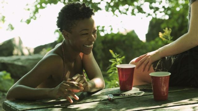 In one of many flashbacks to pre-Gilead America, June's best friend Moira (Samira Wiley) tells June about her latest hookup, with a girl whose name she has accidentally forgotten.