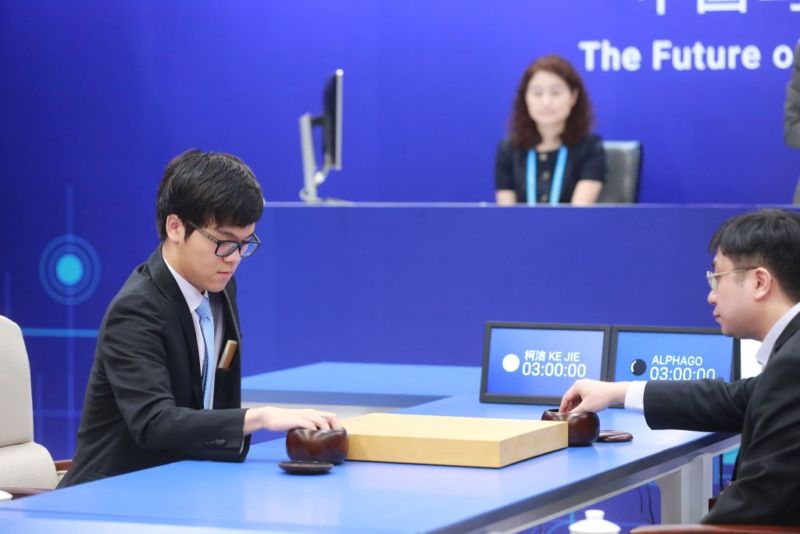 China's 19-year-old Go player Ke Jie (L) prepares to make a move during the first match against Google's artificial intelligence program AlphaGo in Wuzhen, east China's Zhejiang province on May 23, 2017.