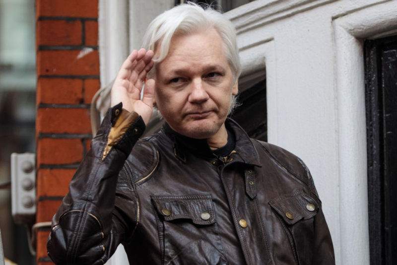 Julian Assange, the founder of WikiLeaks, gestures from the balcony of Ecuador's embassy in London.