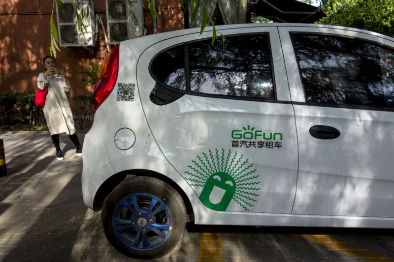 BEIJING, CHINA - GoFun shared e-car parks at roadside. The car-sharing service is an emerging field to draw eyeballs and investment in China. (Photo by Zhang Peng/LightRocket via Getty Images)