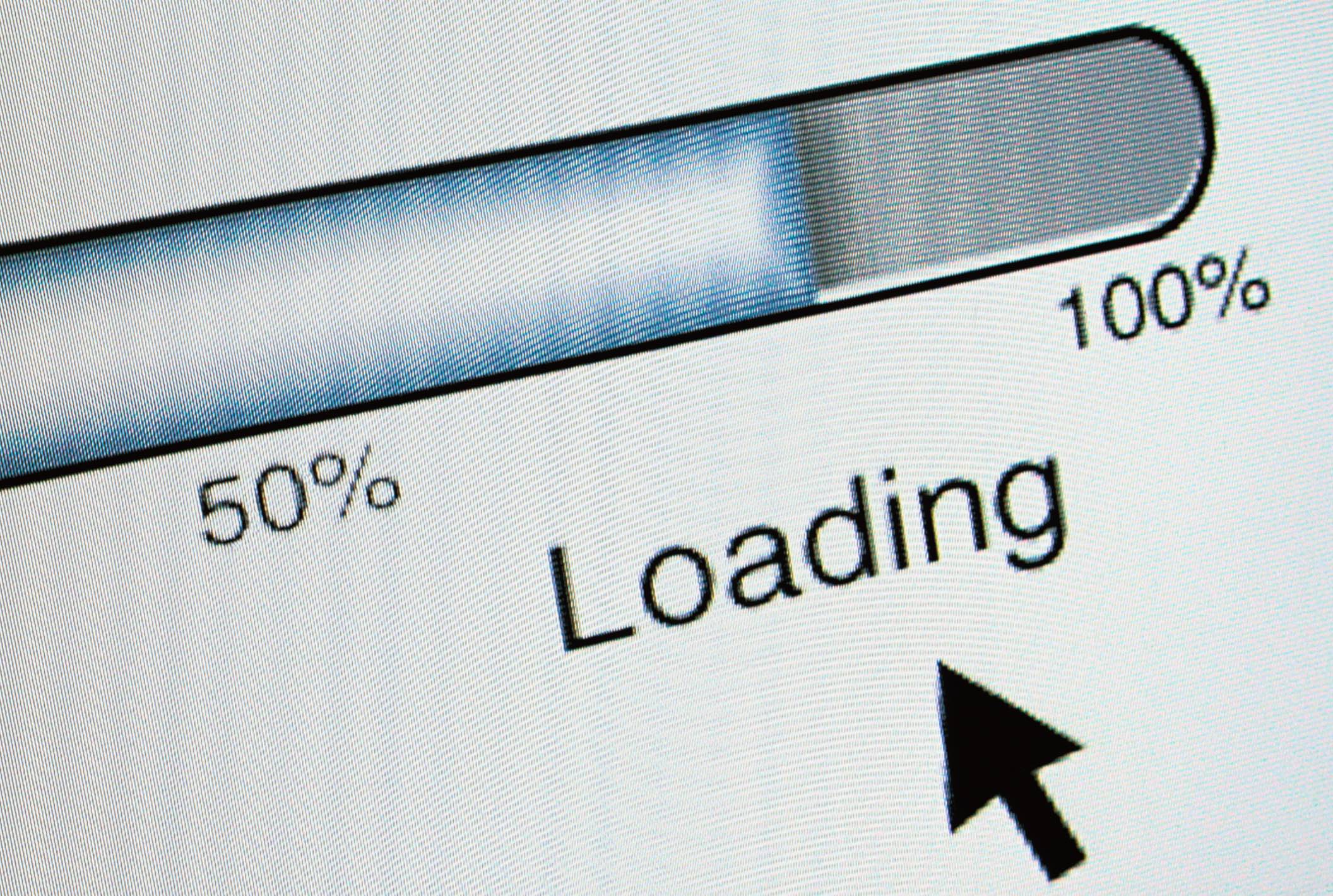 A computer showing a slow-moving loading bar.