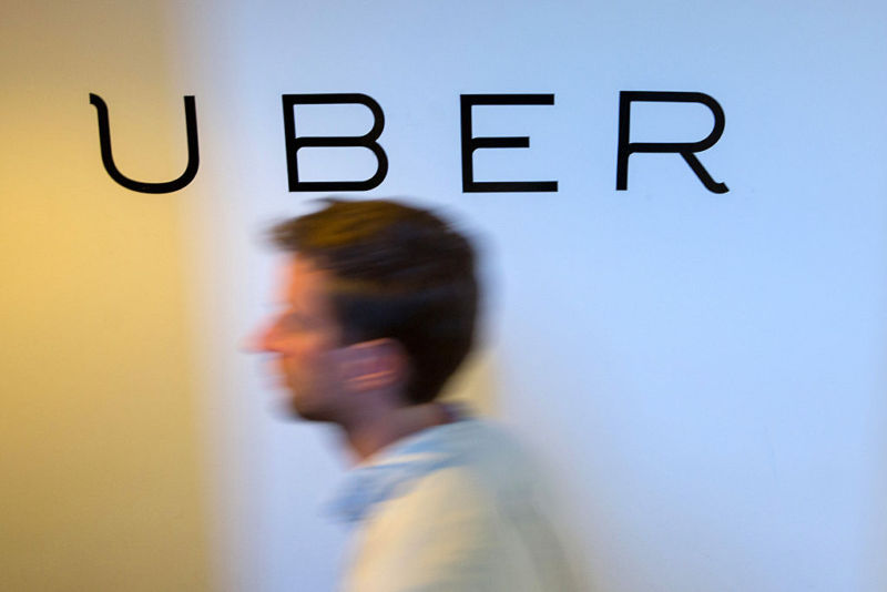 A logo on the wall of an Uber Technologies office in Berlin, Germany.