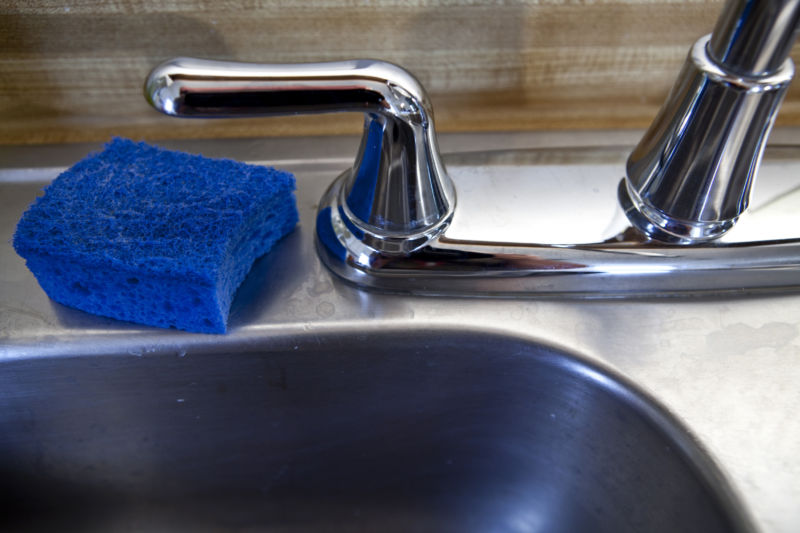 Some germ spots in the home include the kitchen faucet and sponges.  Usually people wash their hands after touching raw meat in the kitchen and often use sponges or cloths to wipe germs from surfaces in the kitchen.  (Photo by Zbigniew Bzdak/Chicago Tribune/MCT via Getty Images)