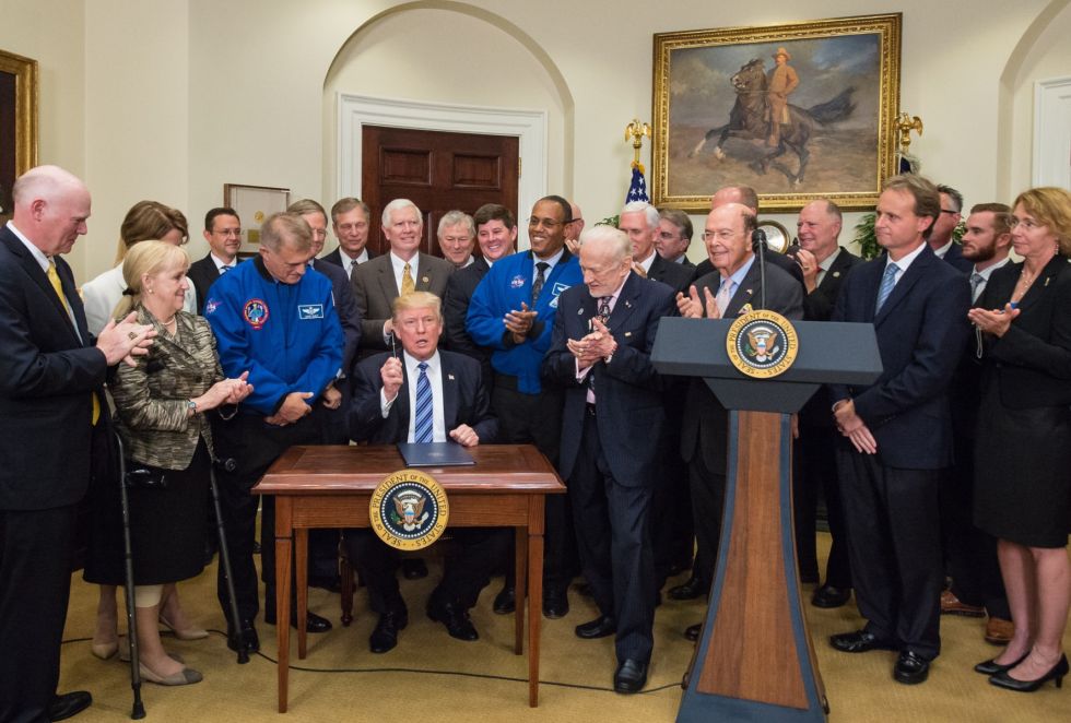 Tory Bruno of ULA, far left, watches as President Trump signs an Executive Order to reestablish the National Space Council in June. Musk was invited but did not attend.