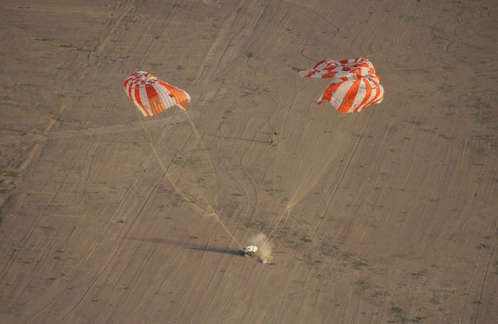 A test model of the Orion spacecraft, with its parachutes, is tested in Arizona.