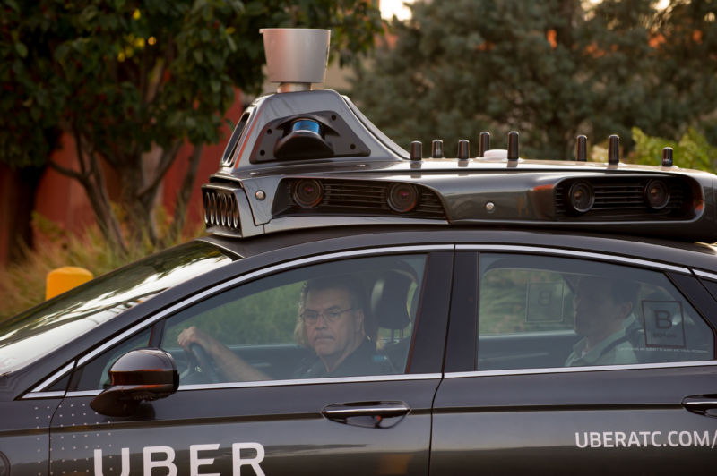 An Uber driverless Ford Fusion drives in Pittsburgh, Pennsylvania. 