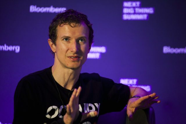 Luke Nosek speaks at the Bloomberg Next Big Thing Summit in 2013. His conference t-shirt game spoke to his fondness for a then-new partnership with SpaceX.