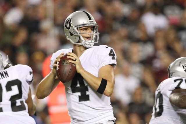 Raiders quarterback Derek Carr throws in the first quarter of play against the Washington Redskins at FedEx Field on September 24, 2017 in Landover, Maryland.