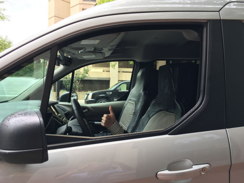 The author sitting in Ford's fake self-driving car.