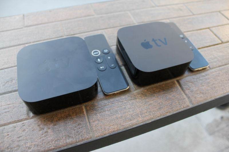 Two sandwich-sized electronic devices on a brick-style surface.