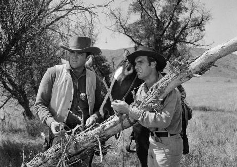 James Arness as Marshal Matt Dillon, left, and Dennis Weaver as Chester Goode in the <em>Gunsmoke</em> episode "Dooley Surrenders," which aired in 1958. CBS has filed a lawsuit over images from this episode that were shared on social media. 