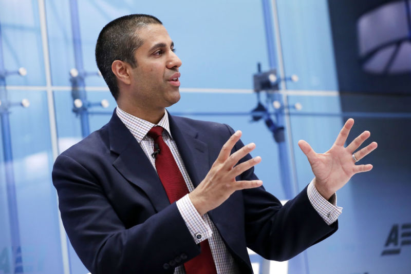 FCC Chairman Ajit Pai speaking and gesturing with his hands.