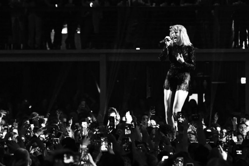 Taylor Swift performing onstage in Houston, Texas. 