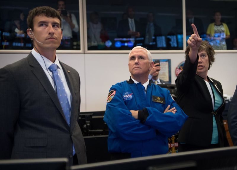 Vice President Mike Pence, center, listens to NASA Deputy Chief Flight Director Holly Ridings, right, and NASA Flight Director Rick Henfling during a tour of the Mission Control Center in Houston in June.