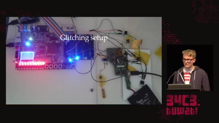 At the 34C3 conference, hacker Derrek shows the soldered FPGA setup that helped him find the decryption key necessary to unlock the system's binaries.