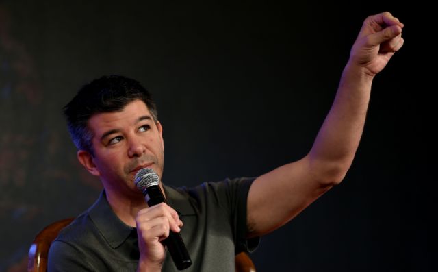 Then-CEO Travis Kalanick gestures as he speaks at an event in New Delhi on December 16, 2016.