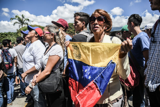 A protester seen holding a Venezuelan flag during the demonstration against Maduro's government at the Central University of Venezuela.