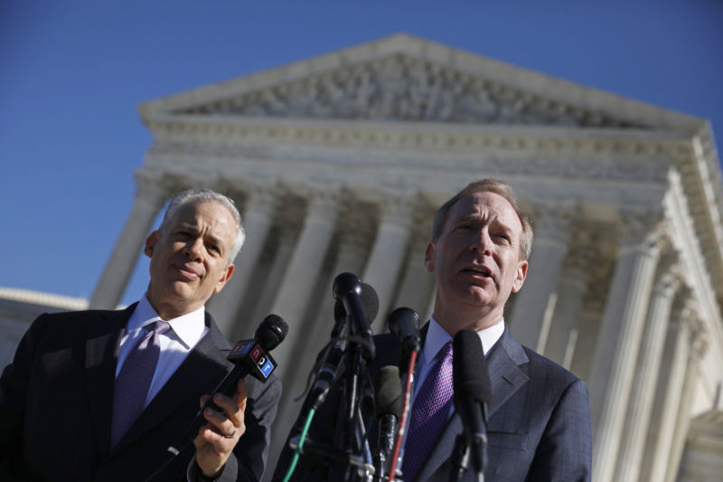 Brad Smith, president and chief legal officer of Microsoft Corp., right, speaks to the media while his attorney, Joshua Rosenkranz, listens outside the US Supreme Court  on Feb. 27, 2018.