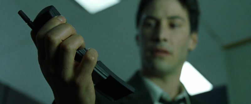 Neo gets a call on the original Nokia 8110.