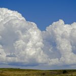 Big white clouds against an azure sky.